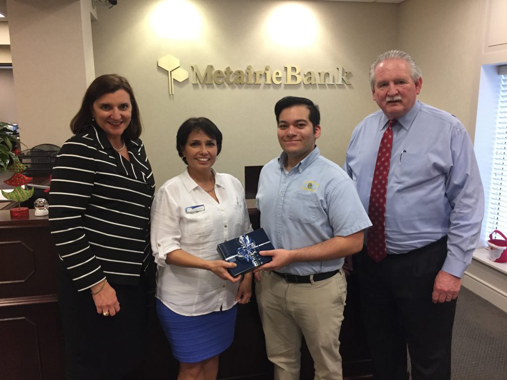 Jose Gamez accepts award for the “365 to Rich” Bank Day contest hosted by the Louisiana Banker’s Association.