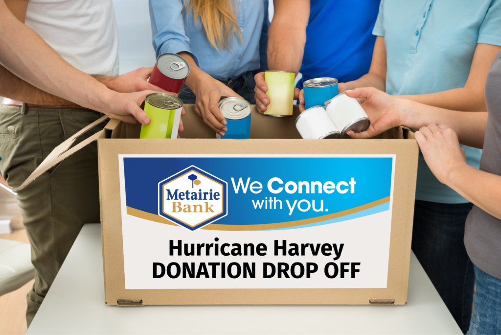 box with people placing canned goods. sign on box says Hurricane Harvey Donation Drop Off